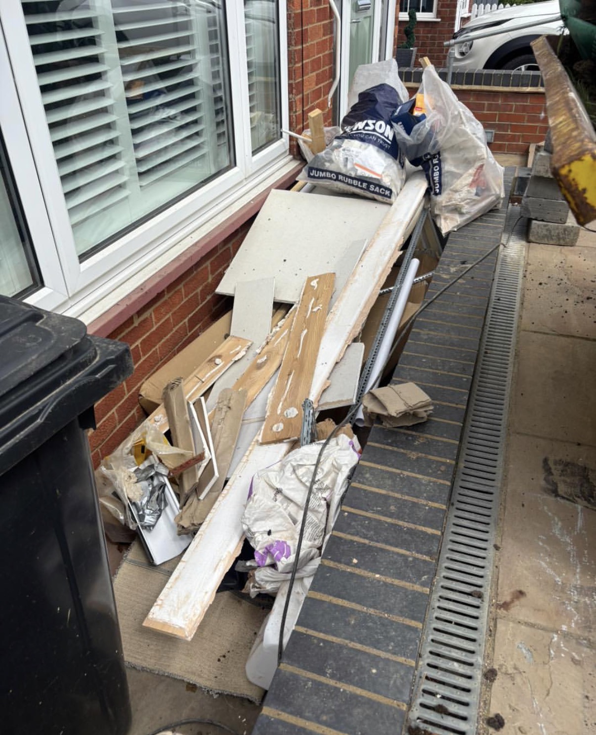 Side passage cleared, DIY waste, rubble sacks and offcuts